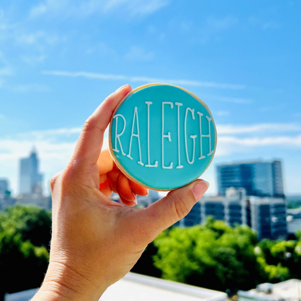 Raleigh cookie in front of skyline